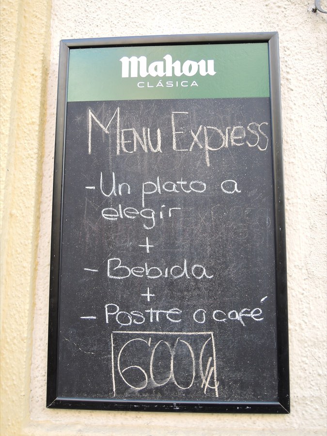 A restaurant chalkboard with the day's specials written in chalk